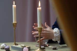 A fortune-teller is preparing to cast a male reproductive organ enlargement spell.