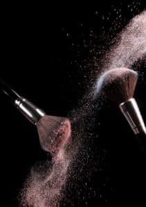 Cosmetic make-up brushes apply male reproductive organ enlargement powder.