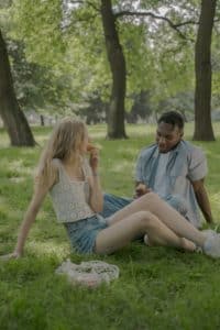 An image of a relaxing couple demonstrates confidence, one of the benefits when you make your penis grow.